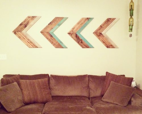 Wooden arrows above couch