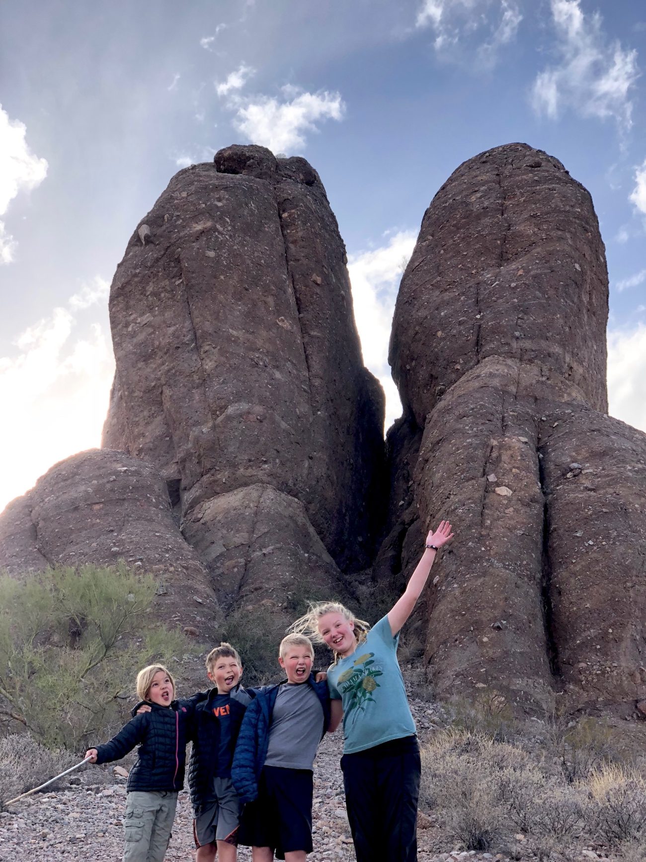 Kids in front of rock in Sonoran Desert outside of Ajo, AZ.