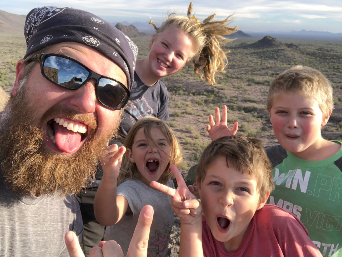 Dad and Kids selfie at the top of butt rock.