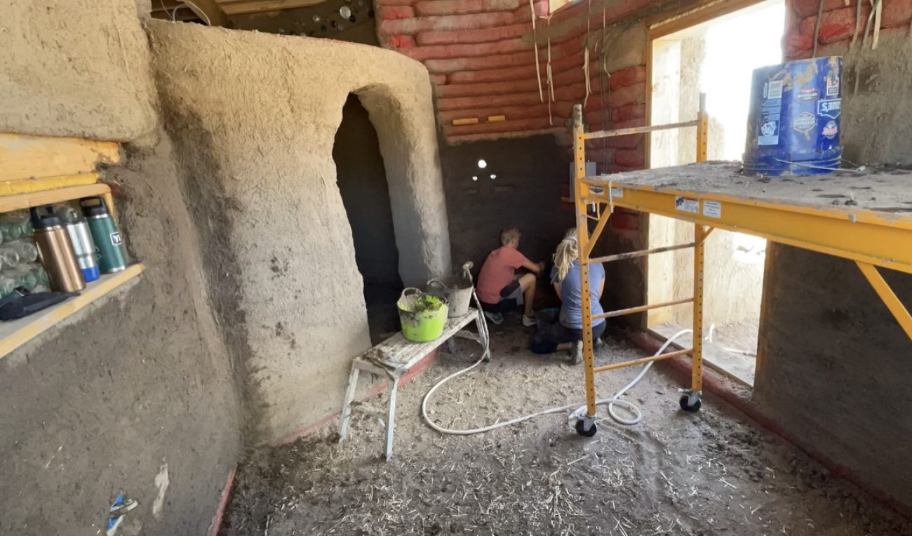 Applying earthen scratch coat interior