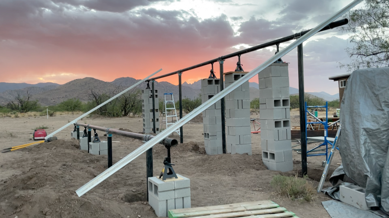 Solar Ground Mount Progress - Main rails held up by cinderblocks.