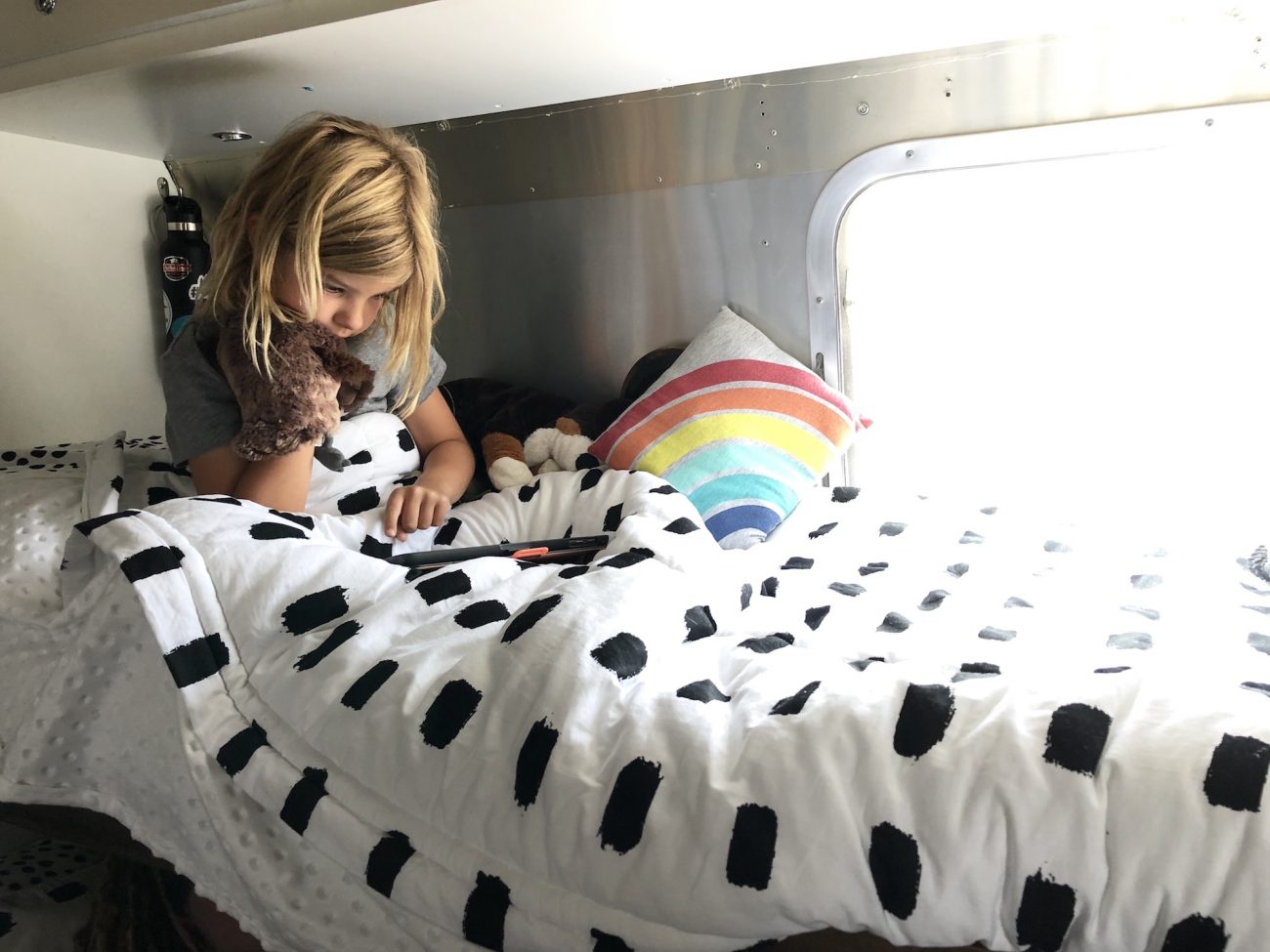Ada in her bunk bed with Beddy's Bedding