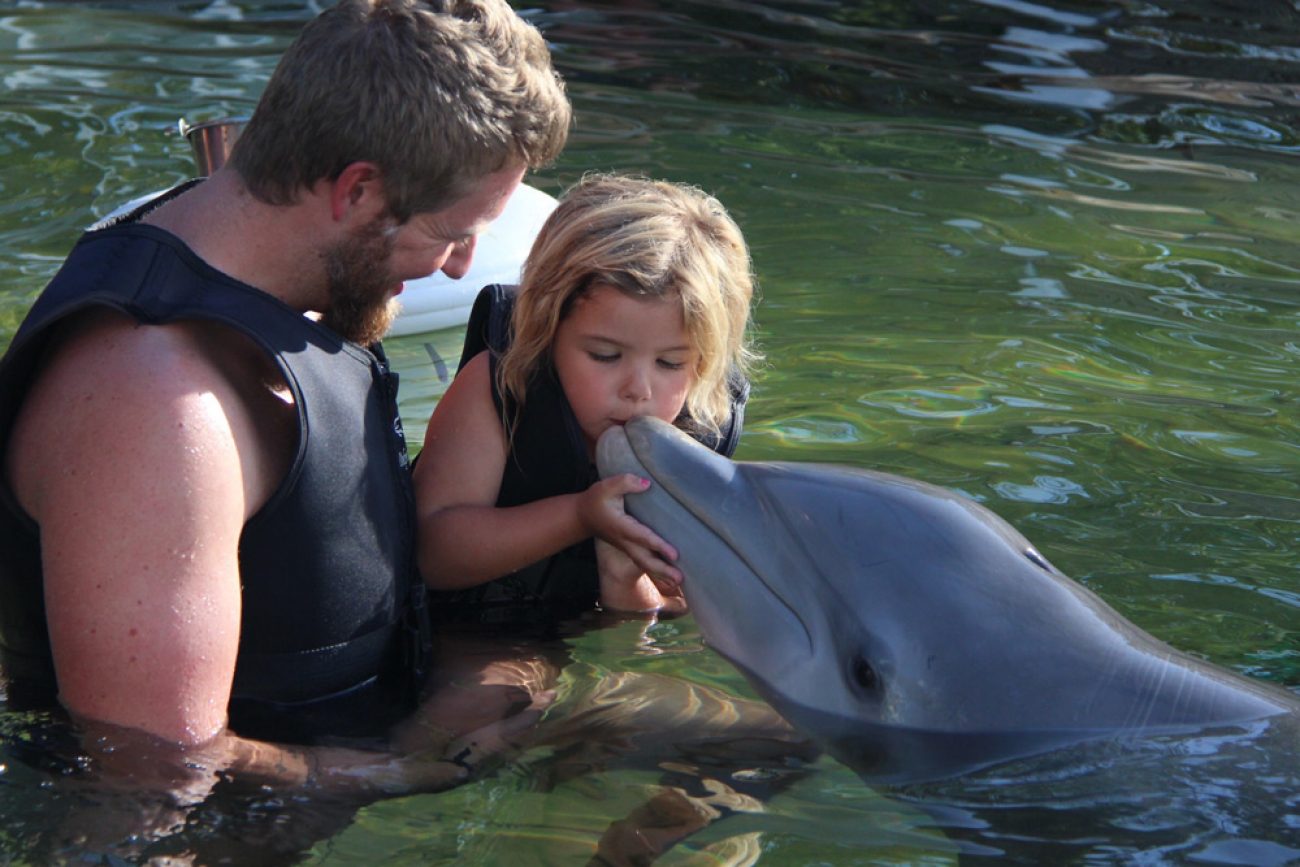 Ada Kisses a Dolphin