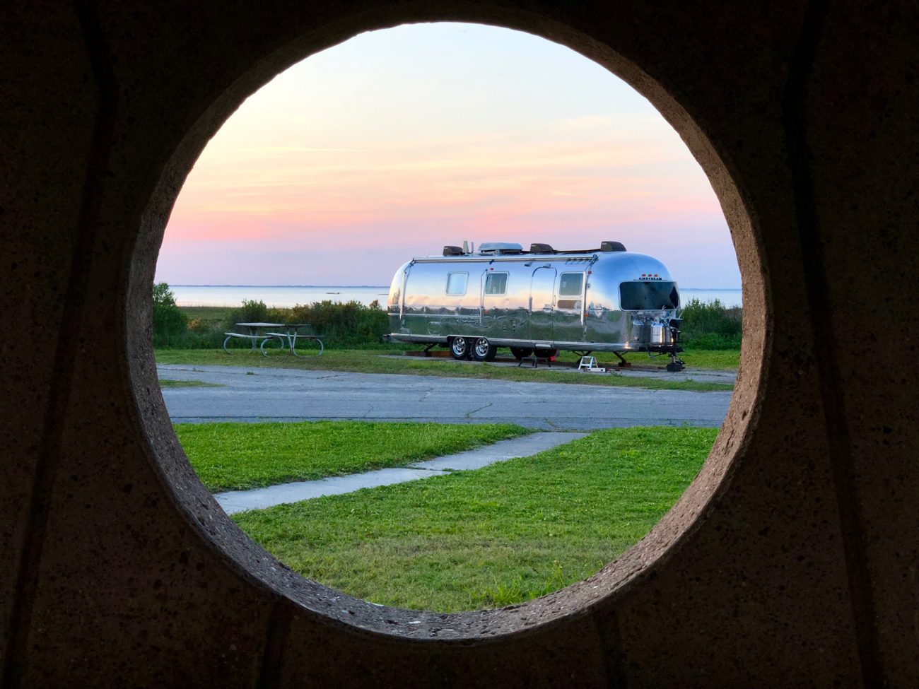 Airstream near cost at Galveston framed by circle