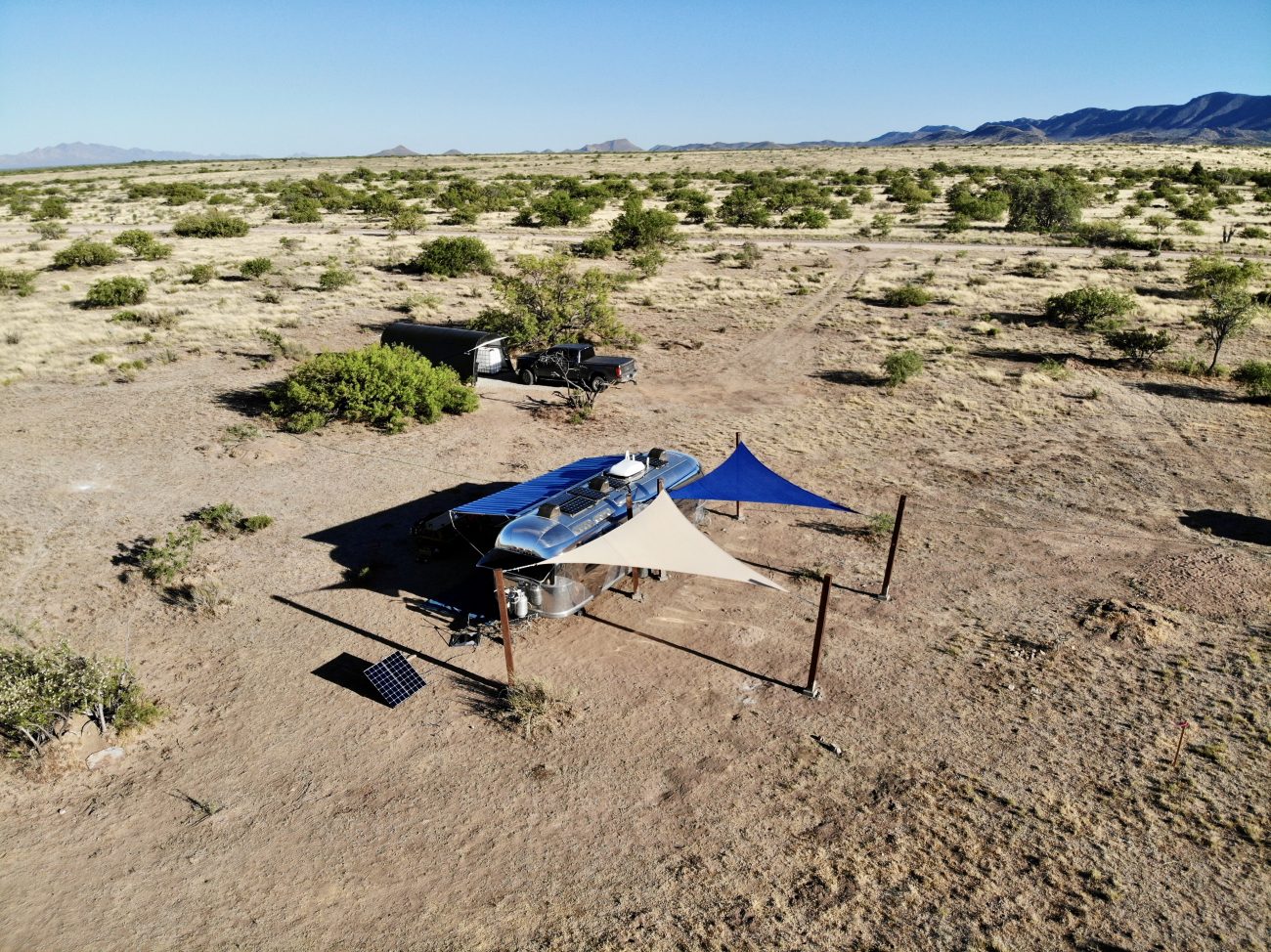 Triangle shade sails shading vintage Airstream.