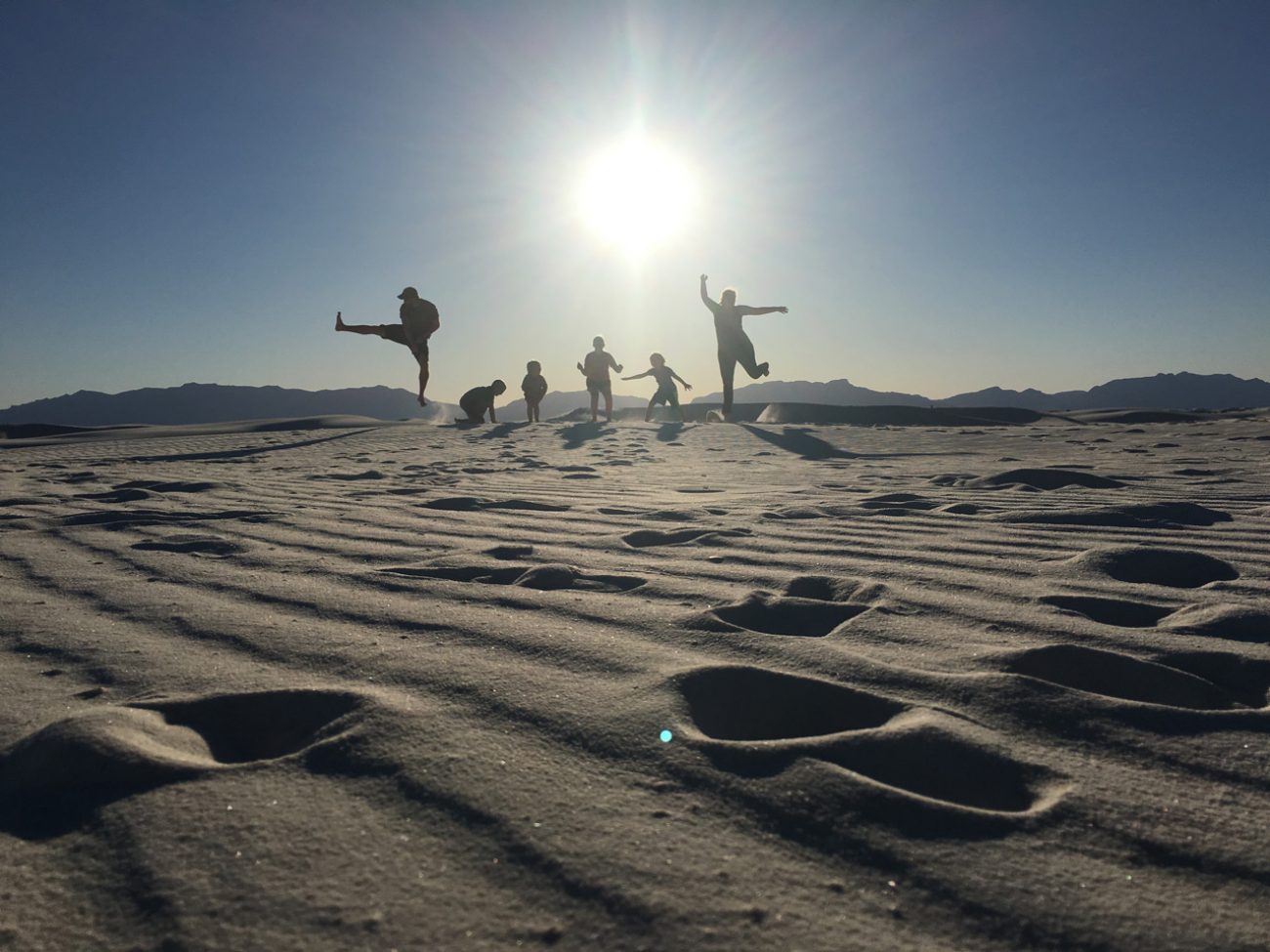 Us jumping at white sands